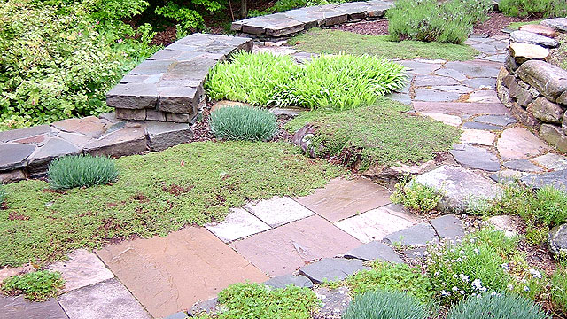 A Combination Oof New England Fieldstone, Quarried Bluestone, And Sandstone Create This Backyard Destination